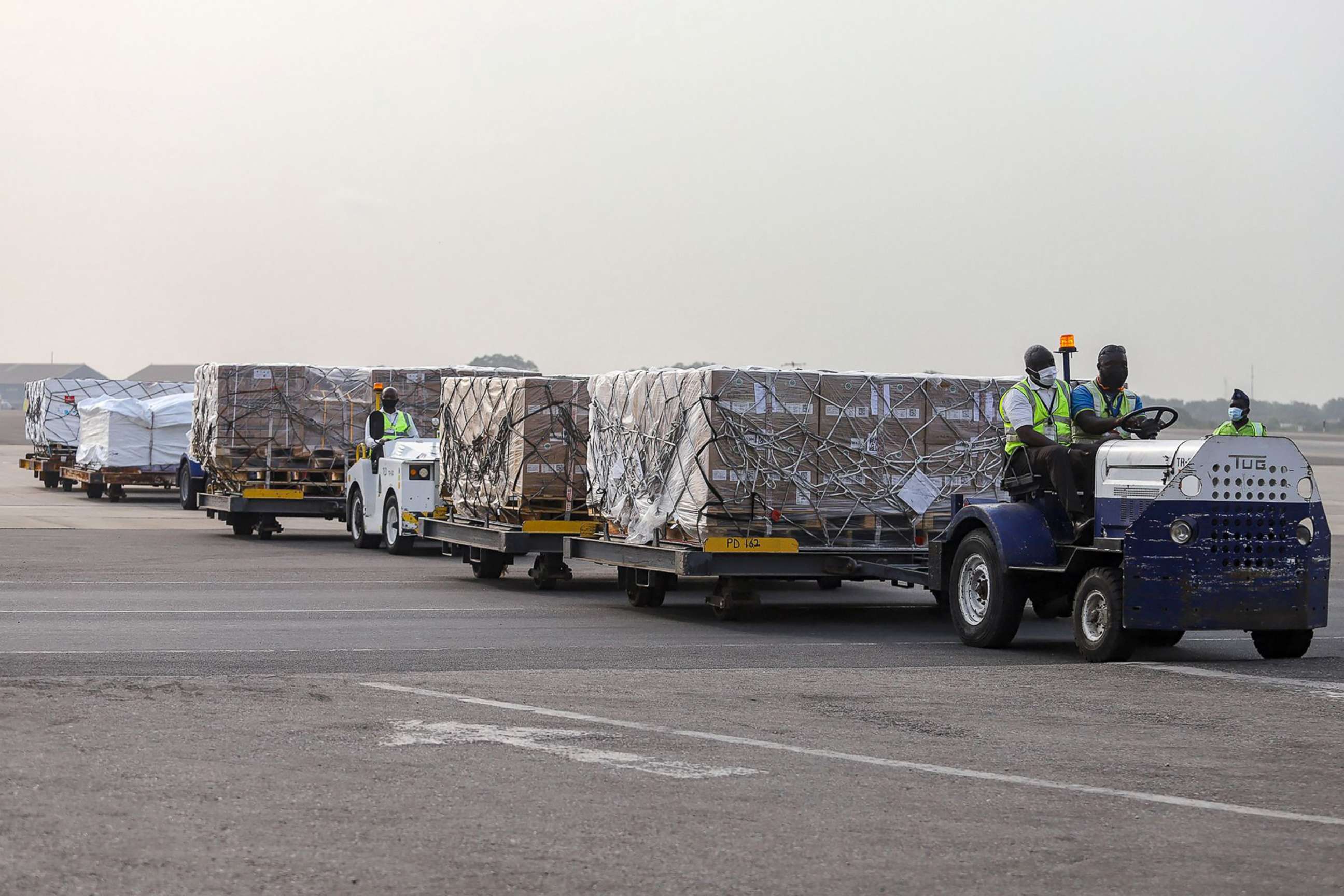 PHOTO: Airport workers transport a shipment of Covid-19 vaccines from the COVAX global  vaccination program, at the Kotoka International Airport in Accra, Ghana, Feb. 24, 2021.
