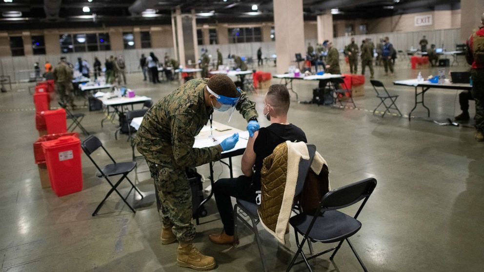PHOTO: A member of the U.S. Armed Forces administers a COVID-19 vaccine at a FEMA community vaccination center, March 2, 2021 in Philadelphia.