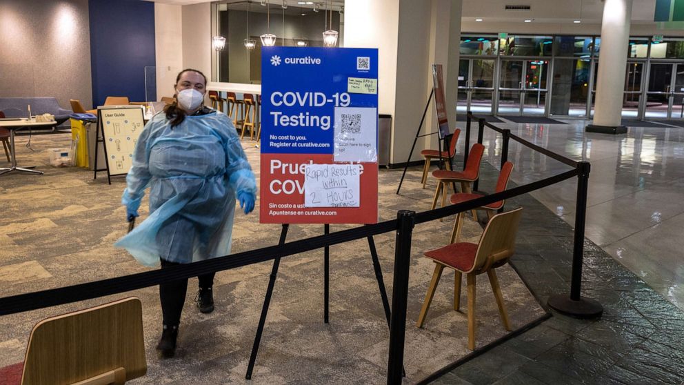 PHOTO: A health worker waits at an empty Covid-19 testing center at the Washington State Convention Center, March 9, 2022, in Seattle.