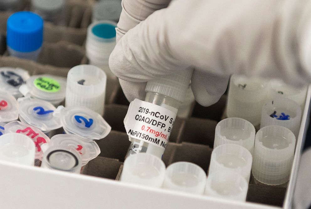 PHOTO: Dr. Nita Patel, Director of Antibody discovery and Vaccine development, lifts a vial with a potential coronavirus, COVID-19, vaccine at Novavax labs in Gaithersburg, Md., March 20, 2020.