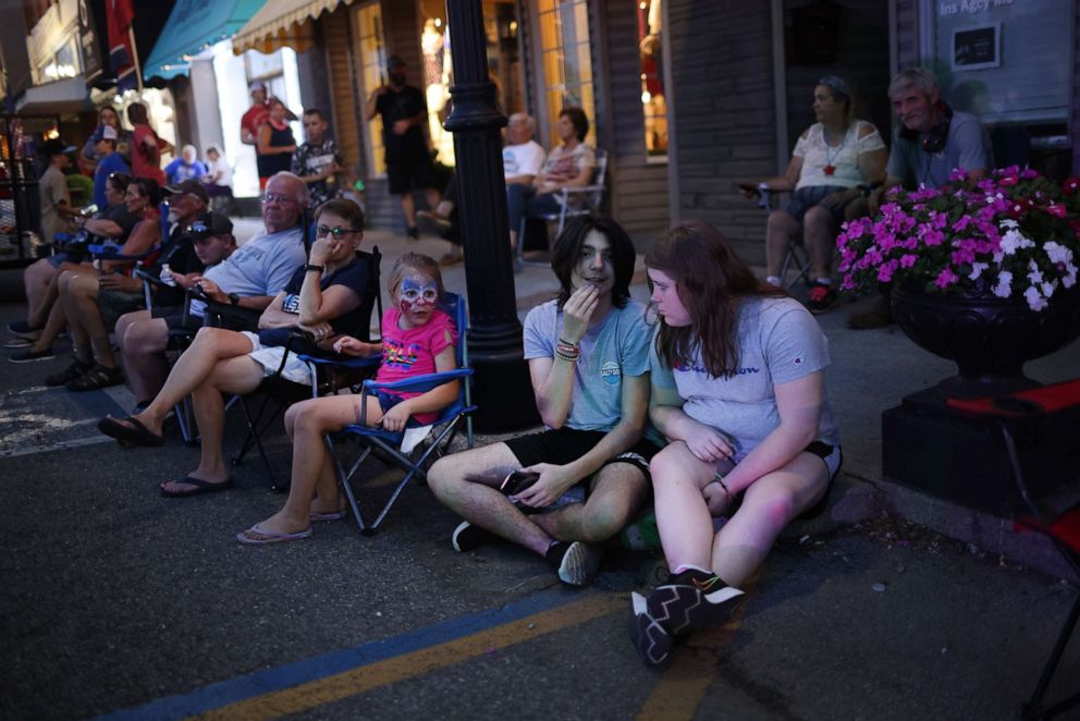 PHOTO: People gather along Main Street to watch fireworks while celebrating Independence Day, July 4, 2021, in Sweetwater, Tenn.