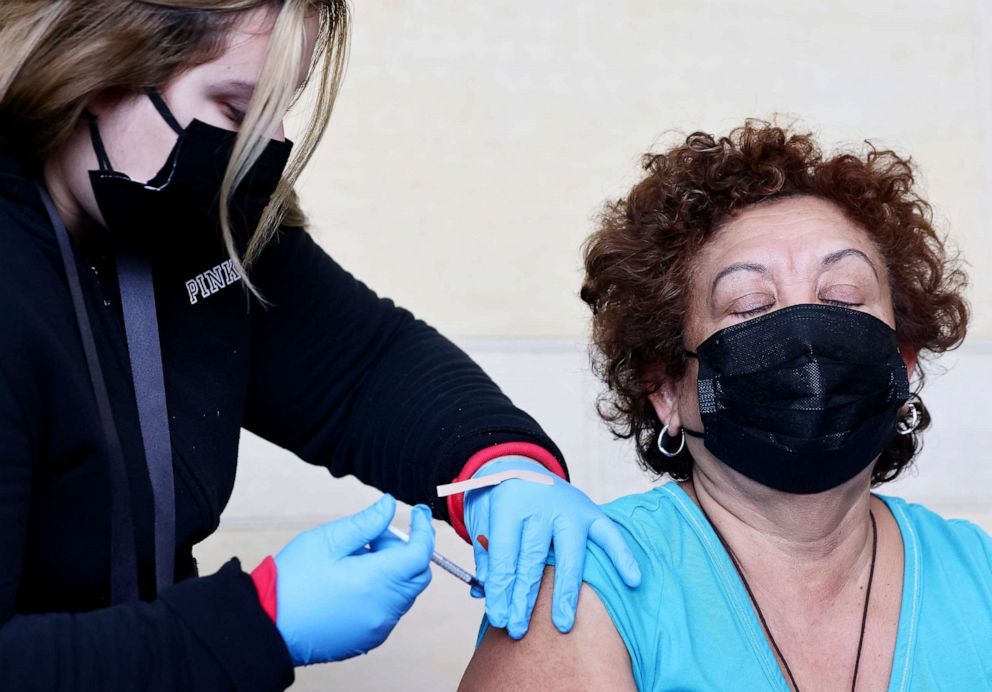 PHOTO: A person receives a COVID-19 vaccination dose, during a free distribution of COVID-19 rapid test kits for those who received vaccination shots or booster shots, at Union Station, Jan. 7, 2022, in Los Angeles.