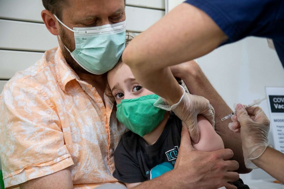 PHOTO: A healthcare worker administers a dose of the Moderna Covid-19 vaccine to a 3 year-old child at the Brooklyn Children's Museum vaccination site, serving children six months to 5-Years old, in New York, June 23, 2022. 