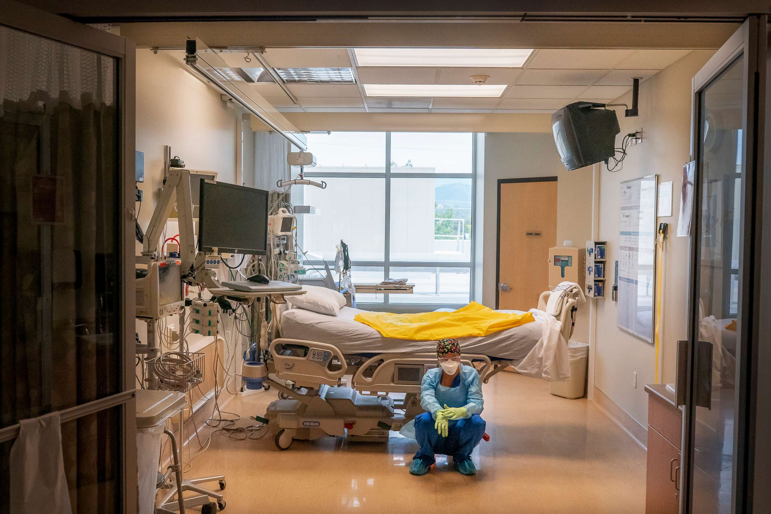 PHOTO: A nurse at Three Rivers Asante Medical Center waits for her next COVID-19 case to be brought from the emergency room shortly after a deceased patient was removed the from the same Intensive Care Unit room, Sept. 9, 2021, in Grants Pass, Oregon. 