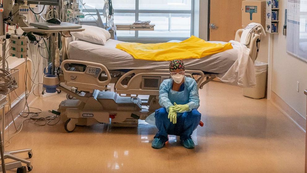 PHOTO: A nurse at Three Rivers Asante Medical Center waits for her next COVID-19 case to be brought from the emergency room shortly after a deceased patient was removed the from the same Intensive Care Unit room, Sept. 9, 2021, in Grants Pass, Oregon. 