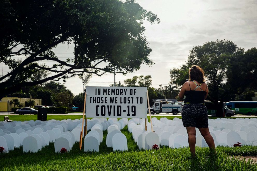 PHOTO: Mock tombstones in a makeshift memorial to those who have died from COVID-19 in North Miami, Fla., Nov. 5, 2020. 