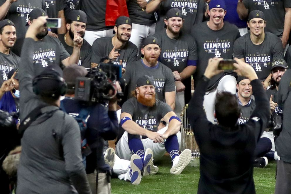 PHOTO:  Justin Turner and the Los Angeles Dodgers pose for a photo after winning  the 2020 MLB World Series in Arlington, Texas, Oct. 27, 2020.