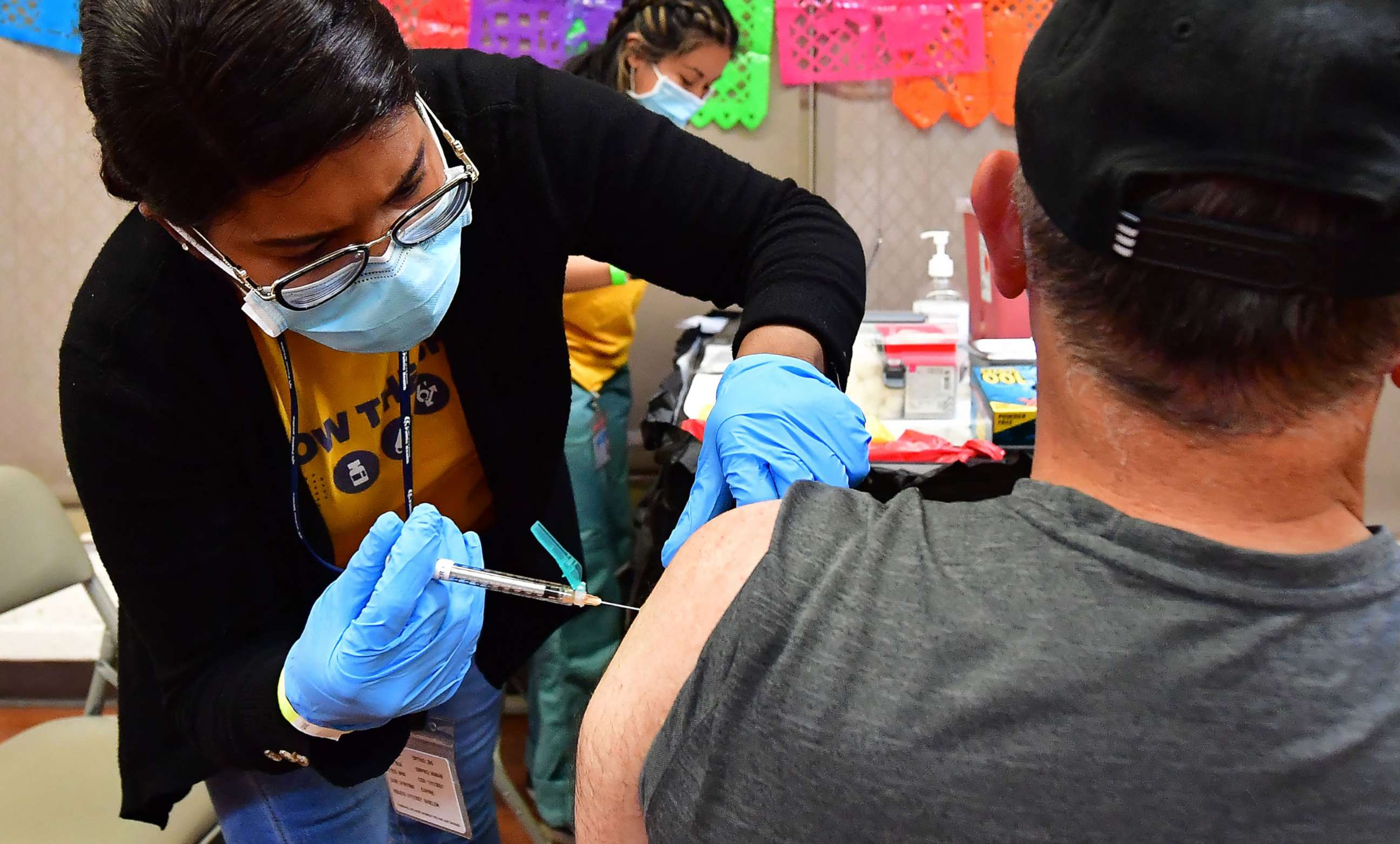 PHOTO: In this May 5, 2022, file photo, a nurse administers the Pfizer booster shot at a COVID-19 vaccination and testing site in Los Angeles.