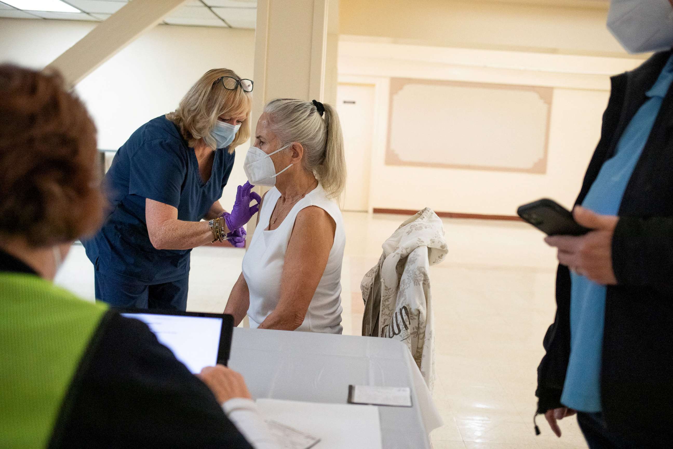 PHOTO: In this April 8, 2022, file photo, a 50 years old and immunocompromised resident receives a second booster shot of the COVID-19 vaccine in Waterford, Mich.