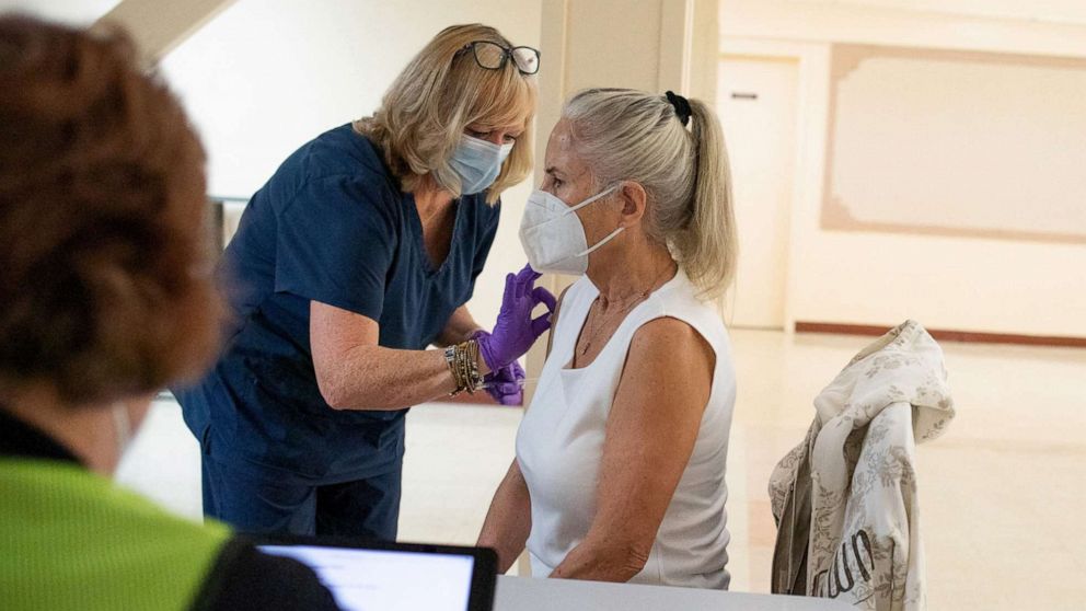 PHOTO: In this April 8, 2022, file photo, a 50 years old and immunocompromised resident receives a second booster shot of the COVID-19 vaccine in Waterford, Mich.