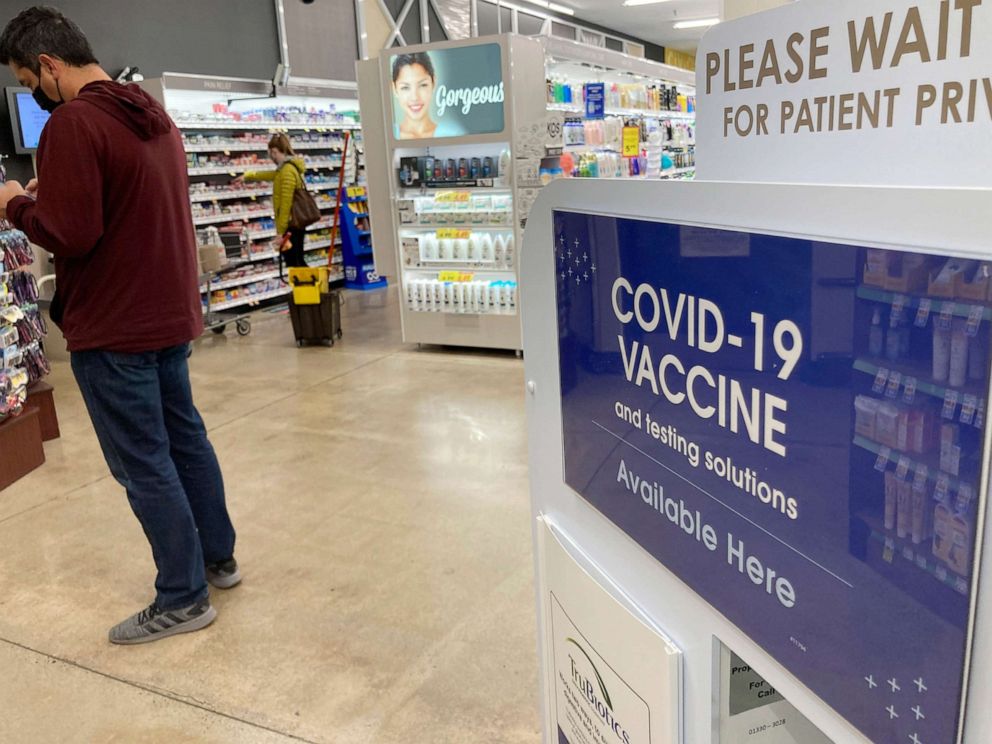 FILE PHOTO: A patient waits to be called for a COVID-19 vaccination booster shot outside a pharmacy at a grocery store in downtown Denver, Colorado, on Nov. 3, 2021, in downtown Denver.