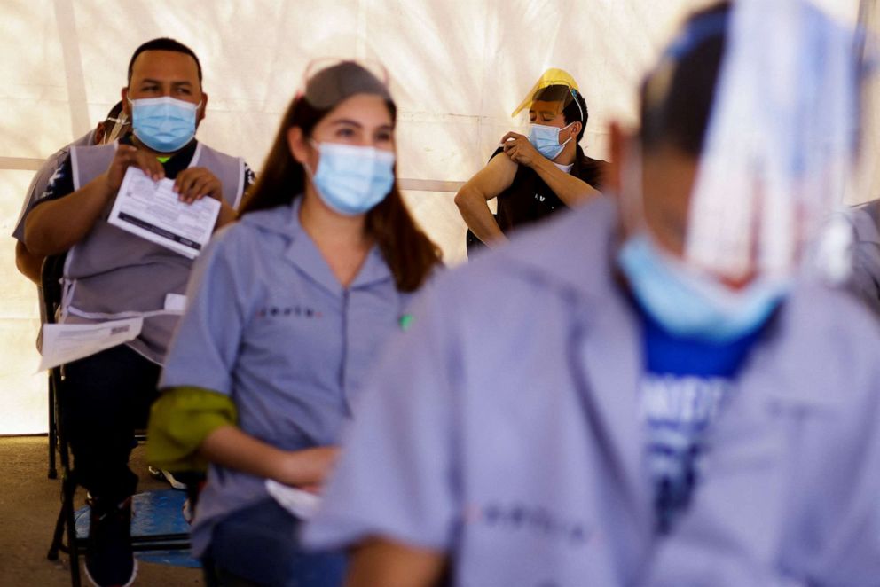 PHOTO: Participants in a mass vaccination event wait in an observation area after receiving a booster shot for the prevention of Covid-19 in Juarez, Mexico, March 22, 2022.