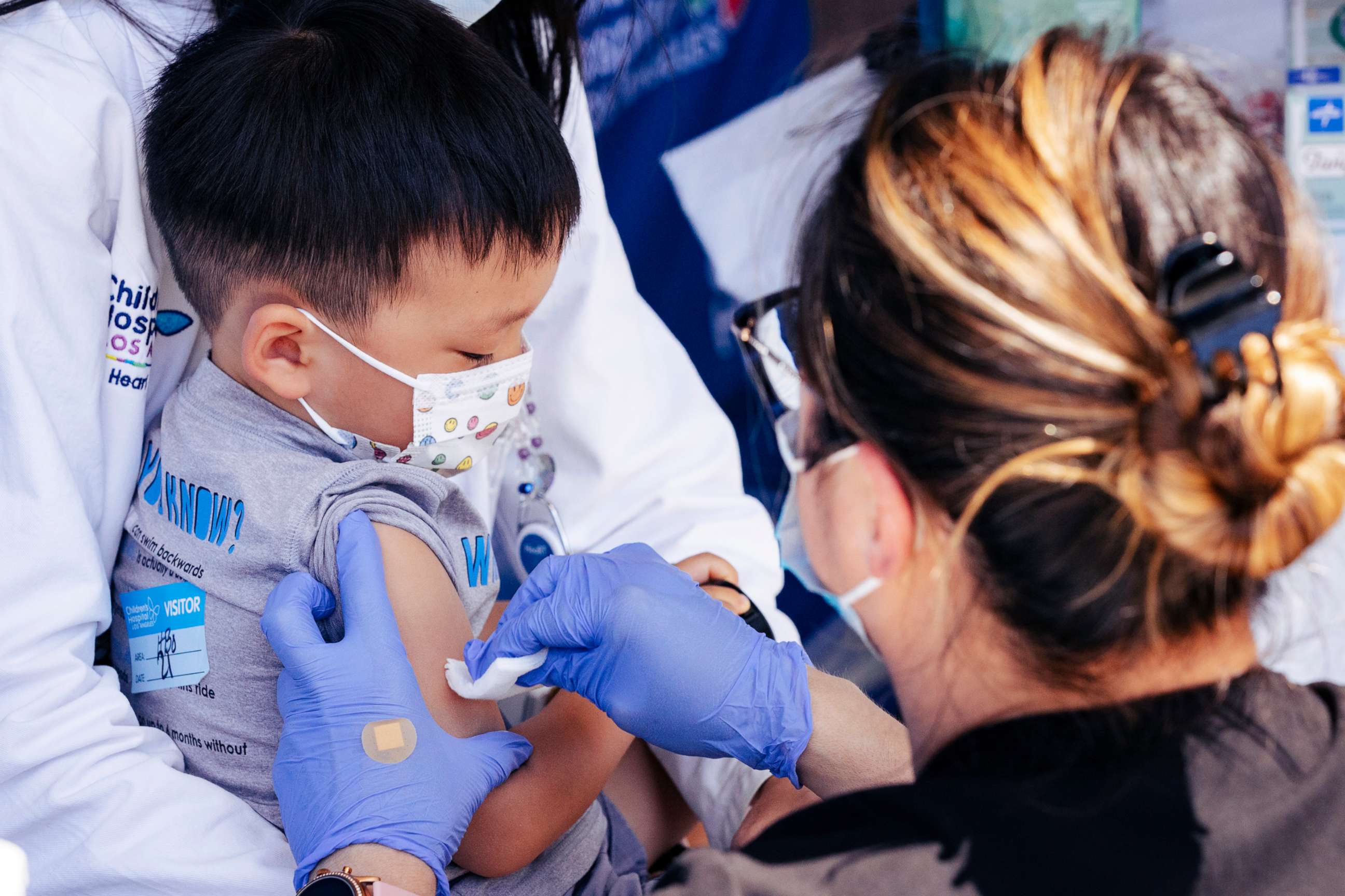 PHOTO: Nurse Monica Lopez prepares to administer the Pfizer COVID-19 vaccine to Callum Diaz-Cheng, age 3, June 21, 2022, in Los Angeles.