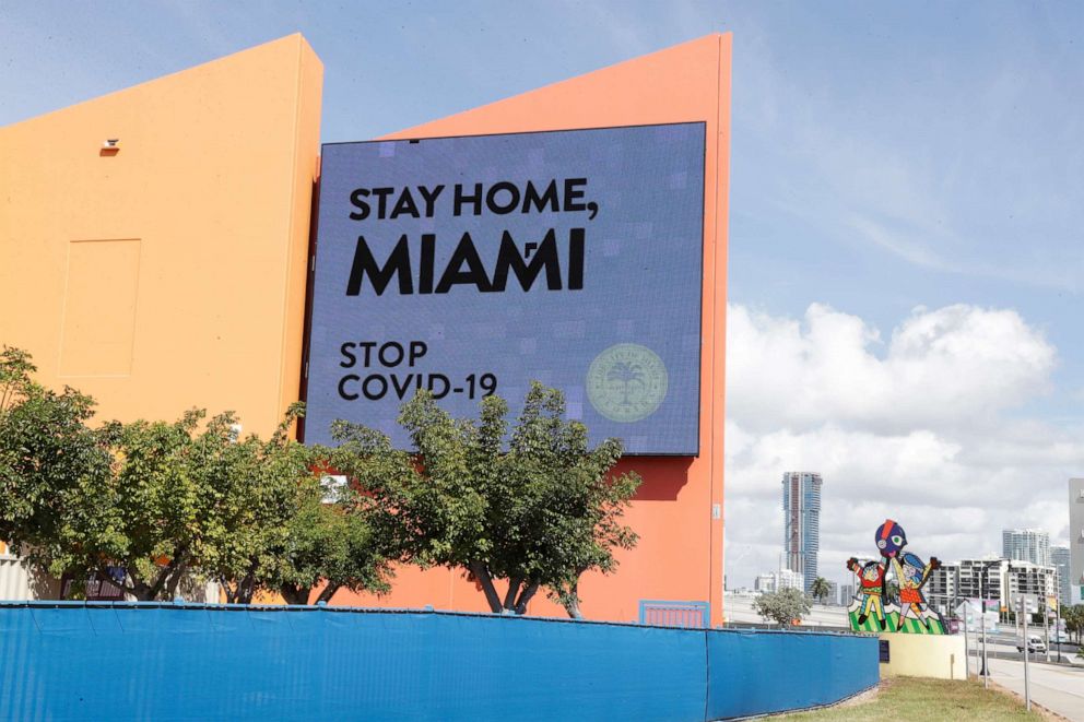 PHOTO: A sign pleading people to stay home to stop the spread of the coronavirus is displayed on a screen at the Miami Children's Museum, March 31, 2020, in Miami. 