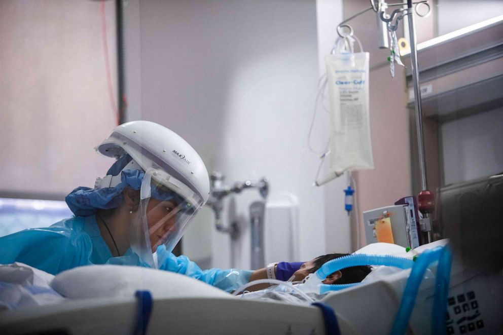 PHOTO: In this Jan. 3, 2021, file photo, registered nurse Yeni Sandoval wears personal protective equipment (PPE) while she cares for a COVID-19 patient in the Intensive Care Unit at Providence Cedars-Sinai Tarzana Medical Center in Tarzana, Calif.