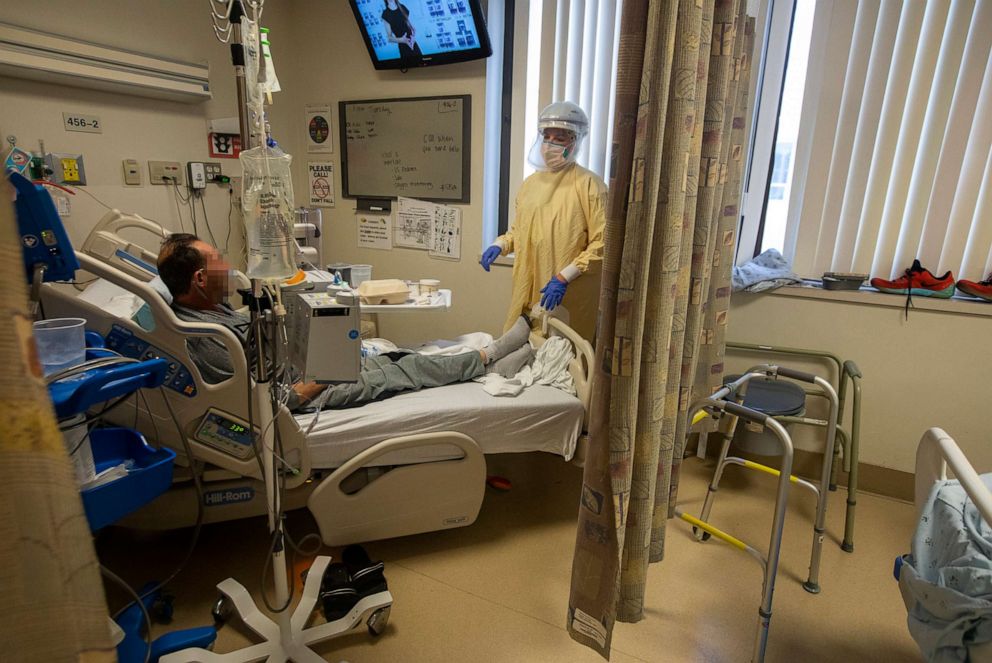 PHOTO: A nurse speaks with A patient in the COVID-19 unit inside Little Company of Mary Medical Center, July 30, 2021, in Torrance, Calif.