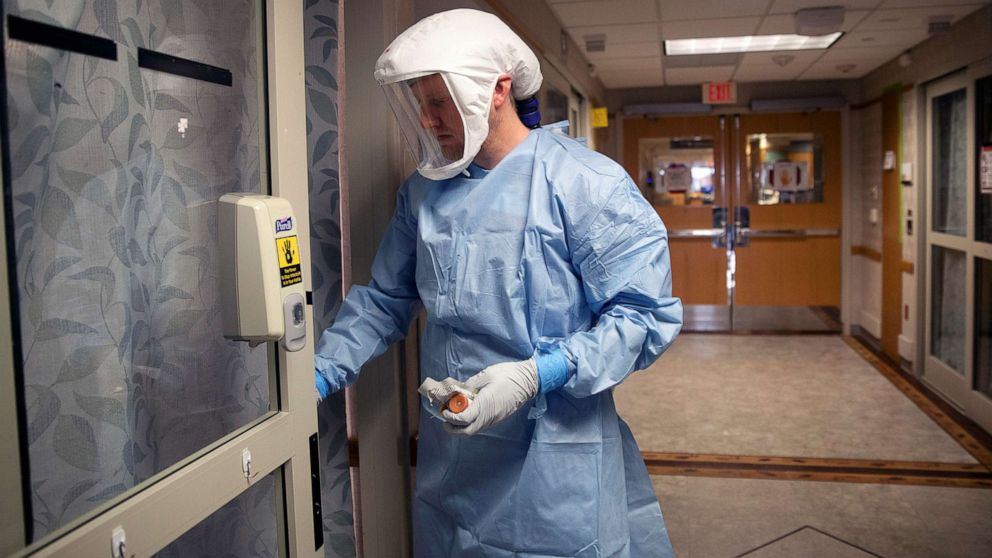 PHOTO: A nurse enters a patient room in a wing housing COVID-19 patients at UW Health University Hospital in Madison, Wis., Nov. 18, 2020.