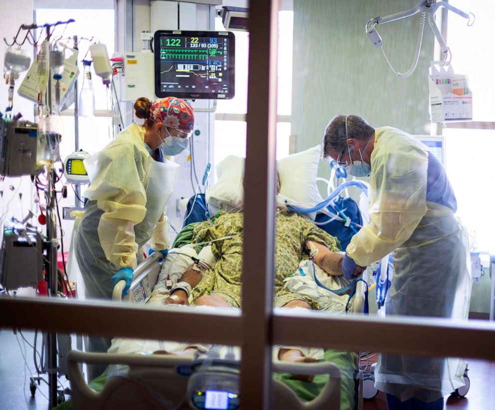 PHOTO: In this Aug. 31, 2021, file photo, Dr. William Dittrich M.D. looks over a COVID-19 patient in the Medical Intensive care unit (MICU) at St. Luke's Boise Medical Center in Boise, Idaho.