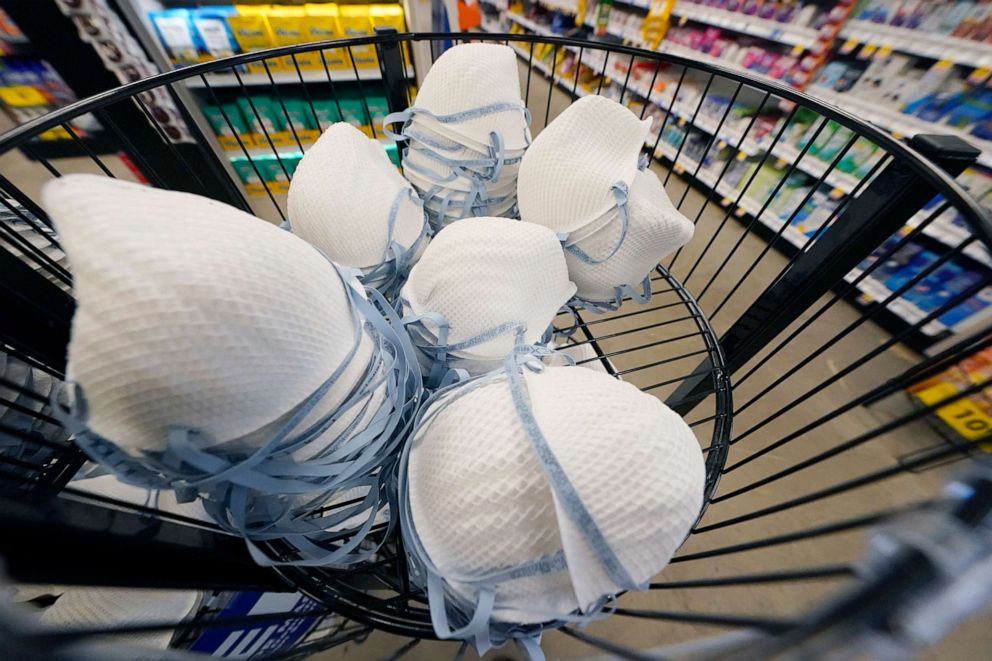 PHOTO: A product stall filled with free N95 respirator masks, provided by the U.S. Department of Health and Human Services, sits outside the pharmacy at this Jackson, Miss., Kroger grocery store, Feb. 2, 2022.