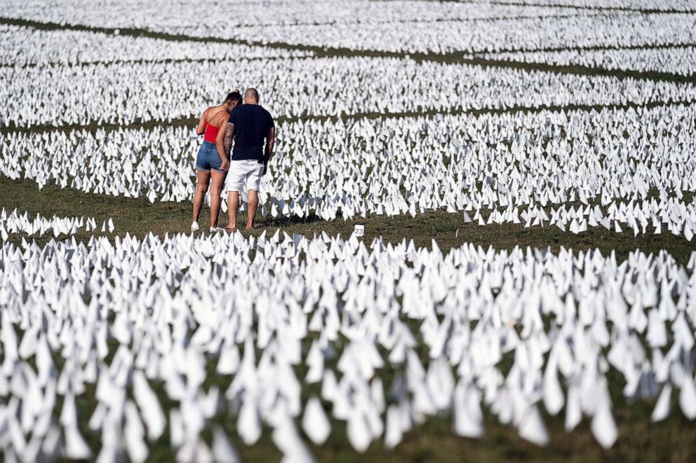 PHOTO: FILE - People visit the 'In America: Remember' public art installation near the Washington Monument on the National Mall, Sept. 18, 2021 in Washington, DC.