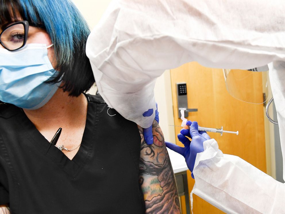 PHOTO: Volunteer Melissa Harting receives an injection of a possible COVID-19 vaccine, developed by the National Institutes of Health and Moderna Inc., in Binghamton, N.Y., July 27, 2020.