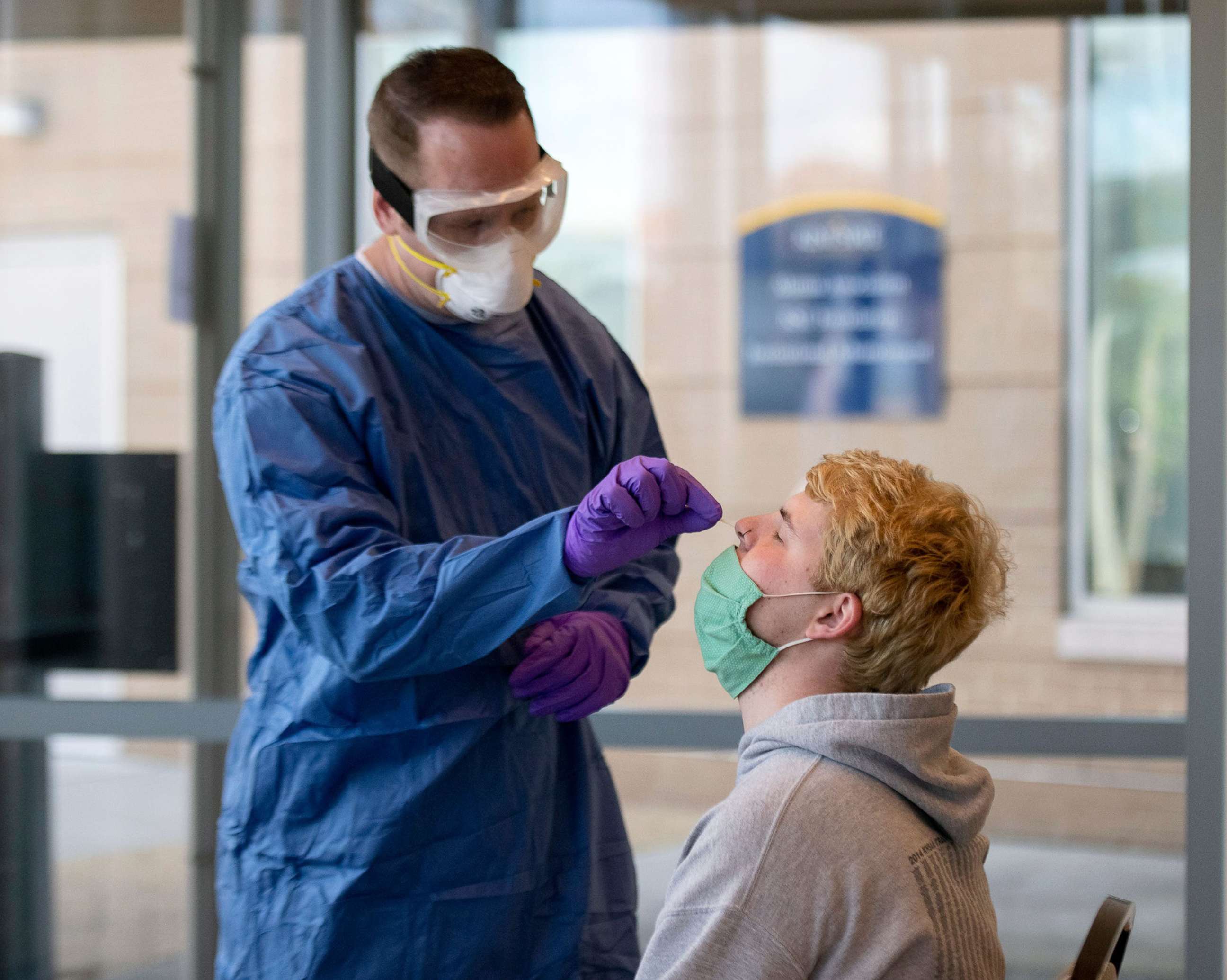 PHOTO: Andrew Robinson, a Kent State sophomore, takes a COVID test in Ohio, 
 Oct. 2, 2020. The Ohio Pandemic Testing Team from the Ohio National Guard, with Kent Health Department, provide free COVID-19 test at Kent State University. 
