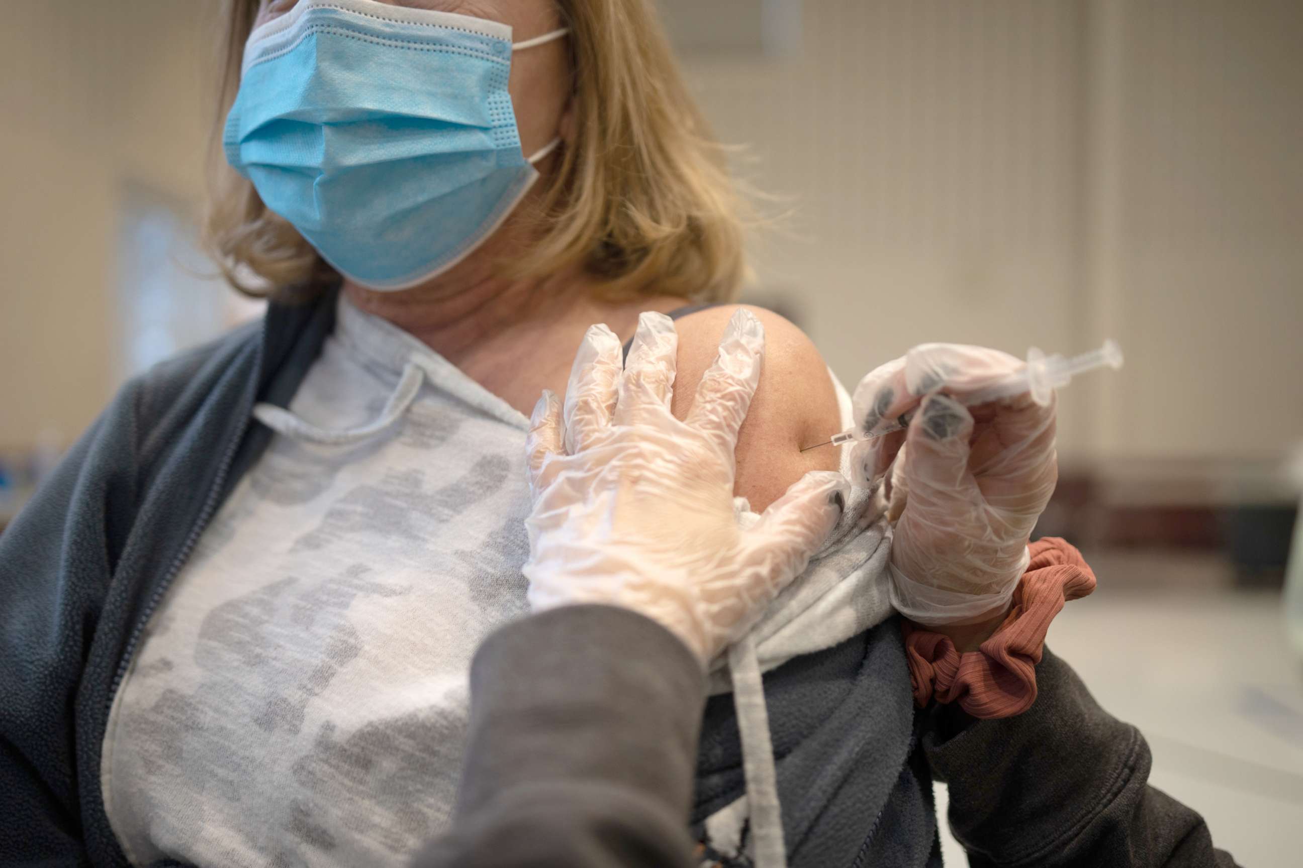 PHOTO: A resident receives a Covid-19 booster shot at a vaccine clinic in Lansdale, Pa., Apr. 5, 2022. 