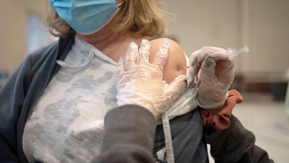 PHOTO: A resident receives a Covid-19 booster shot at a vaccine clinic in Lansdale, Pa., Apr. 5, 2022. 