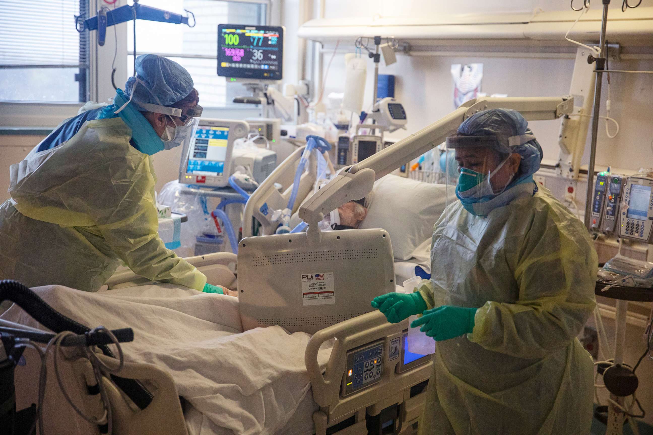 PHOTO: Two nurses assess the breathing ability of a COVID-19 patient using oxygen on the Intensive Care Unit (ICU) floor at the Veterans Affairs Medical Center on April 21, 2020 in Brooklyn, N.Y.