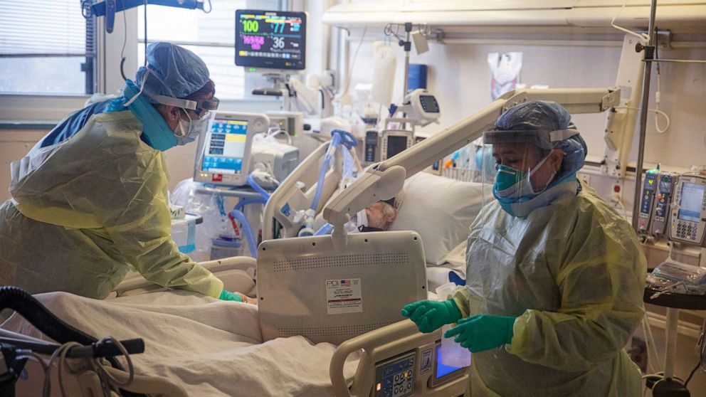 PHOTO: Two nurses assess the breathing ability of a COVID-19 patient using oxygen on the Intensive Care Unit (ICU) floor at the Veterans Affairs Medical Center on April 21, 2020 in Brooklyn, N.Y.