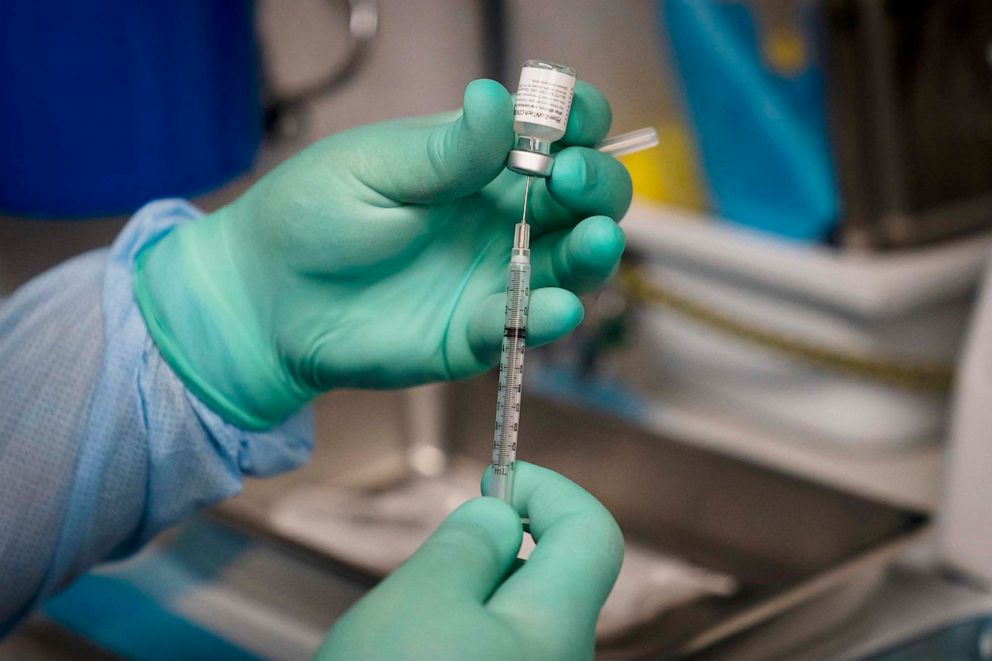 PHOTO: A syringe is prepared with the Pfizer COVID-19 vaccine at a mobile vaccine clinic in Santa Ana, Calif., Aug. 26, 2021.