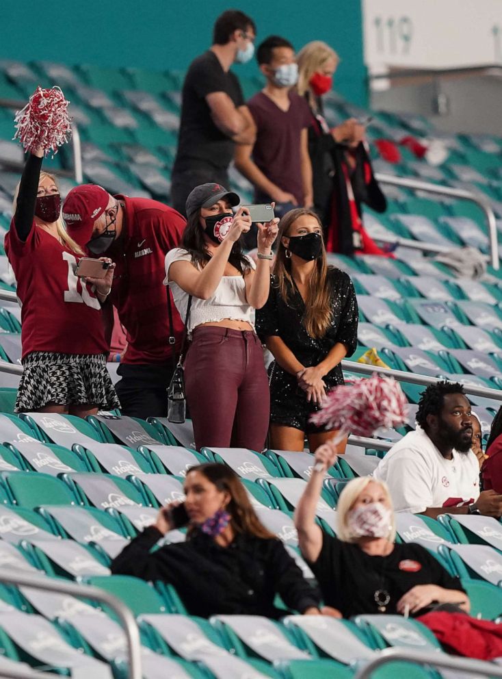 PHOTO: Football fans adhere to COVID-19 restrictions in the seating area during the first half of the 2021 NCAA National Championship football game in Miami Gardens, Fla., Jan 11, 2021.