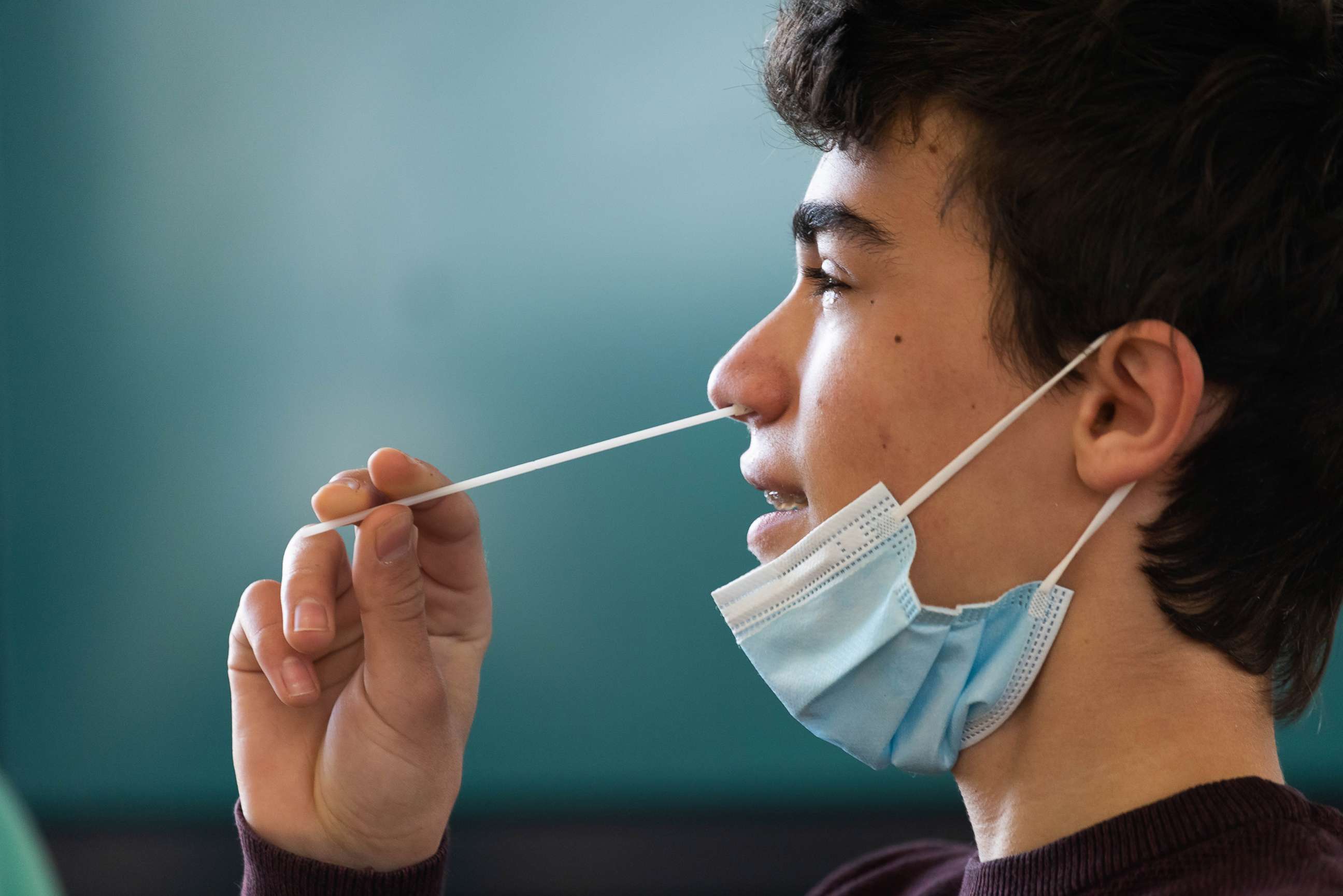 PHOTO: A student performs a COVID-19 self-test.