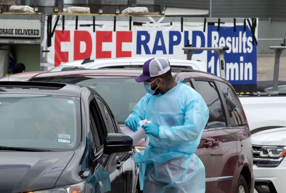 PHOTO: A mobile private COVID testing site that saw little traffic in November is overwhelmed with residents wishing to get tested during the holidays, on Dec. 26, 2021, in Austin, Texas.