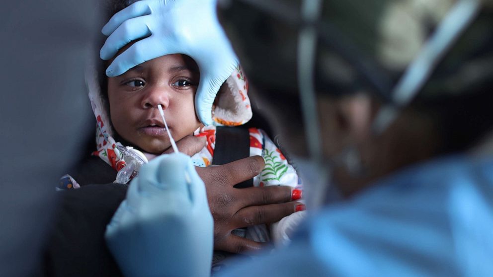 PHOTO: A child is tested for the COVID-19 virus at Roseland Community Hospital, Dec. 14, 2020, in Chicago, Illinois.