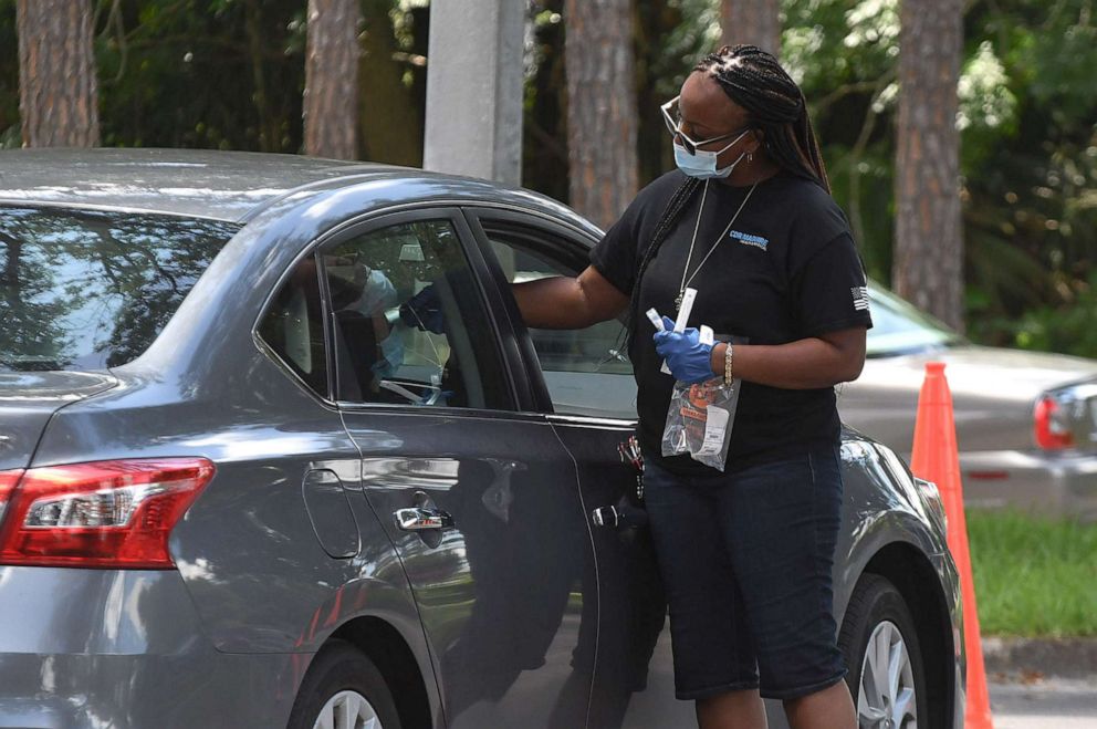 PHOTO: A person receives a nasal test at a COVID-19 testing and vaccination site at Barnett Park in Orlando, Fla., July 21, 2021.