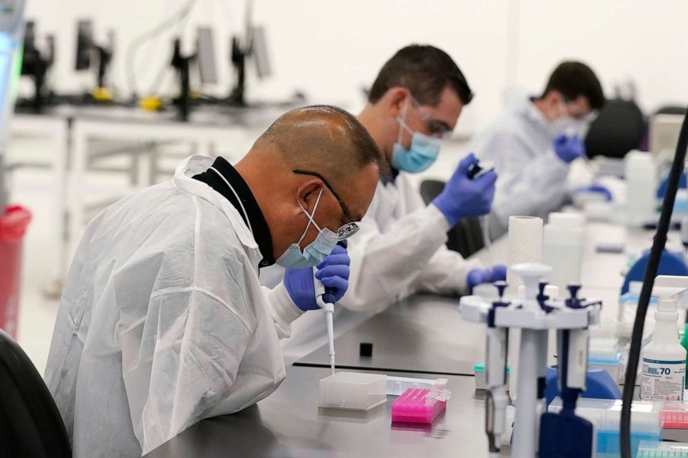 PHOTO: In this Oct. 30, 2020, technicians conduct COVID-19 tests at a facility in Valencia, Calif.