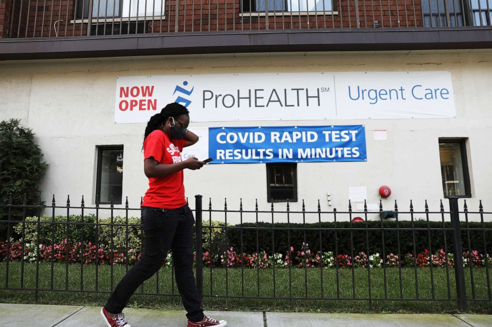 PHOTO: A sign displays a new rapid coronavirus test on the new Abbott ID Now machine at a ProHEALTH center in Brooklyn on Aug. 27, 2020, in New York City.