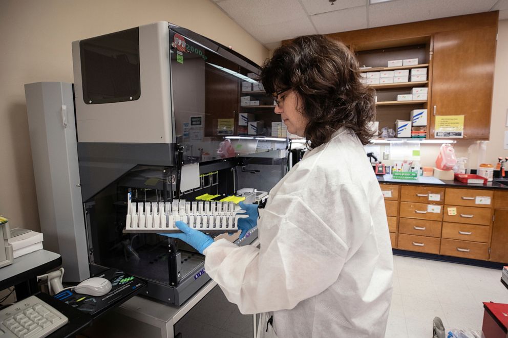 PHOTO: Donna Schaferkotter, medical laboratory scientist at UMMC, analyzes samples during COVID-19 testing in Jackson, Miss., March 25, 2020, 