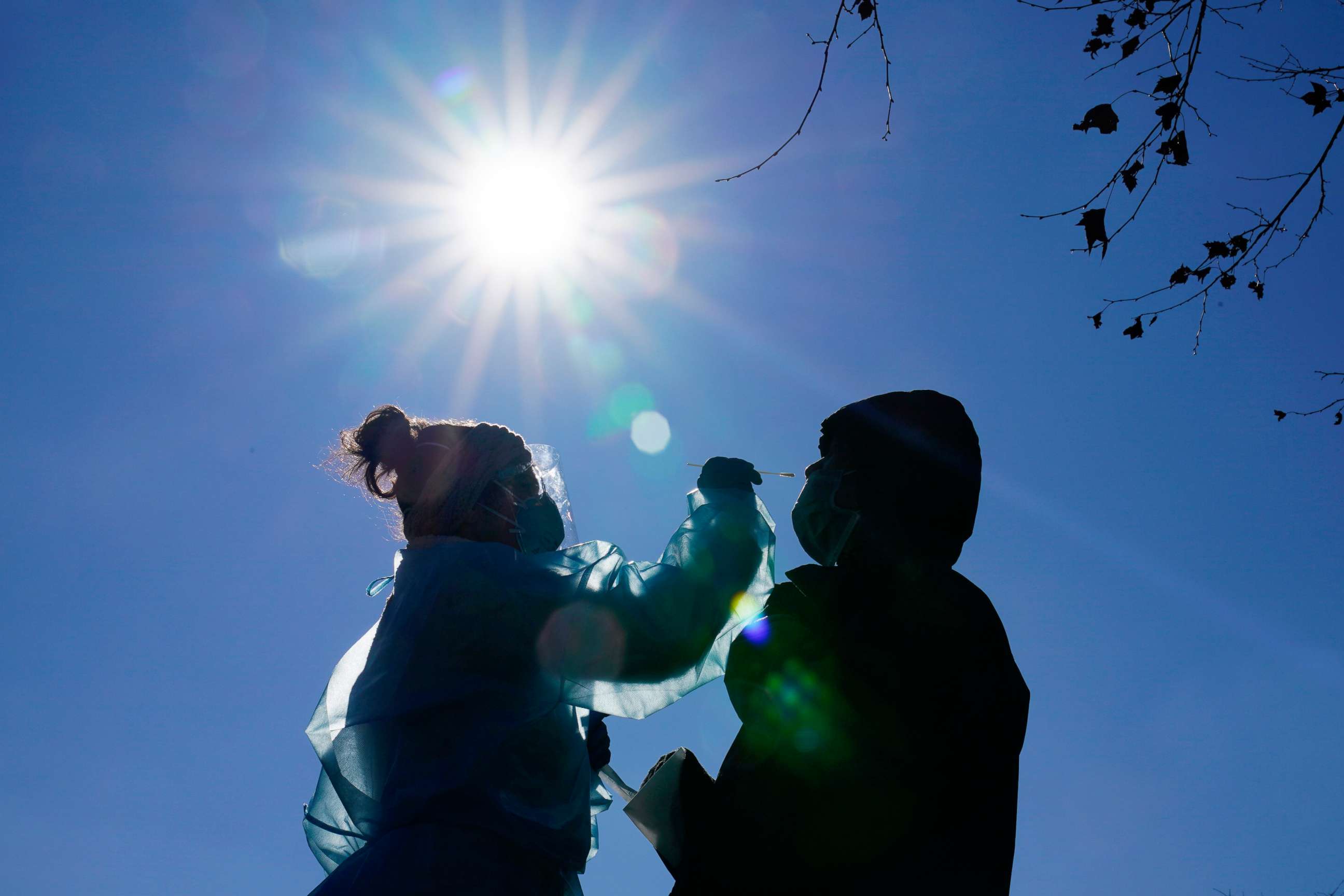 PHOTO: A registered nurse swabs a patient during testing for COVID-19 in Mifflin Square Park in south Philadelphia, Dec. 10, 2020.