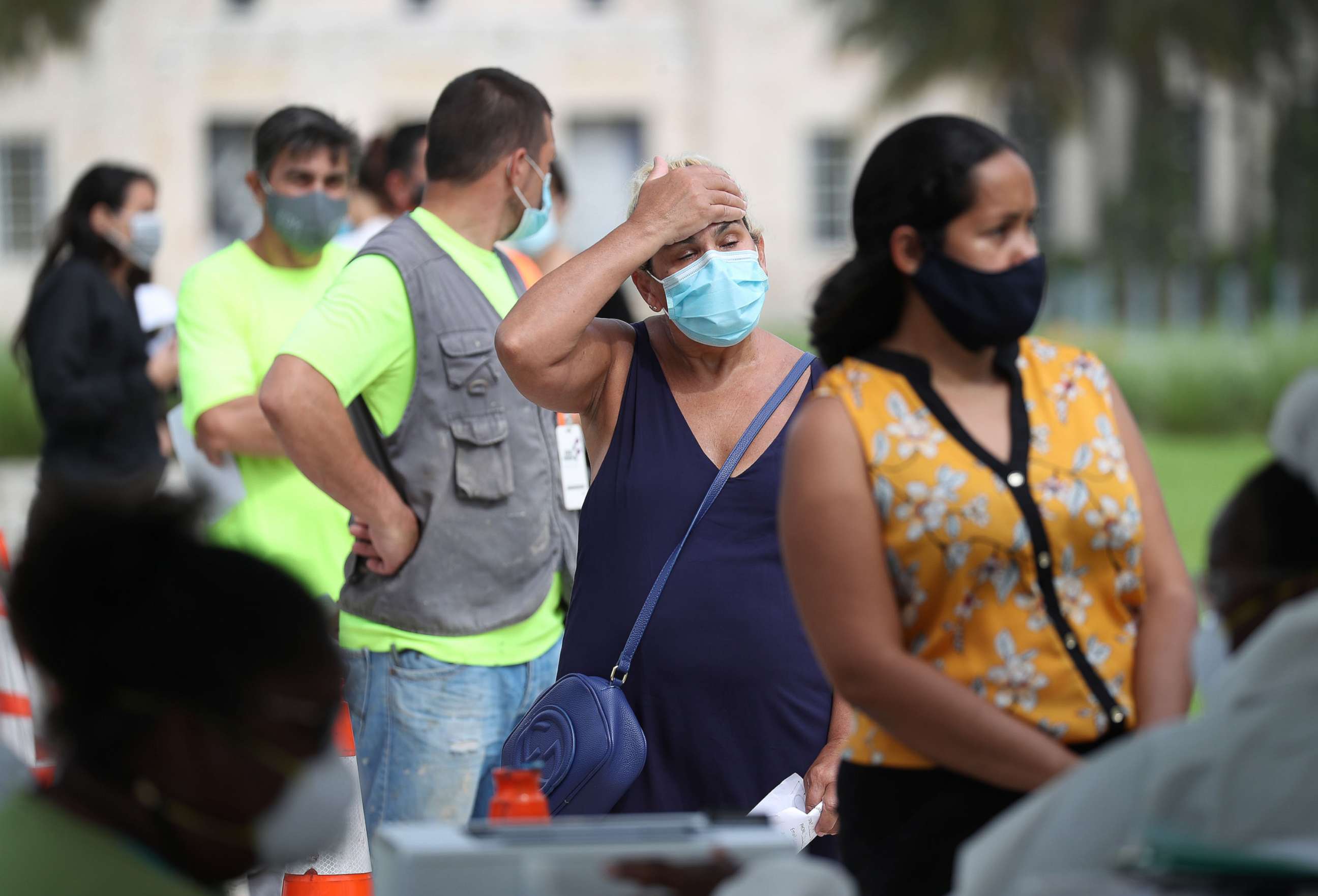 PHOTO: People stand in line to be tested for COVID-19 at an Aardvark Mobile Healths Mobile Covid-19 Testing Truck on July 17, 2020, in Miami Beach, Fla.