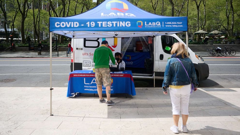 PHOTO: People get tested at a midtown COVID-19 testing site in New York, on May 3, 2022.