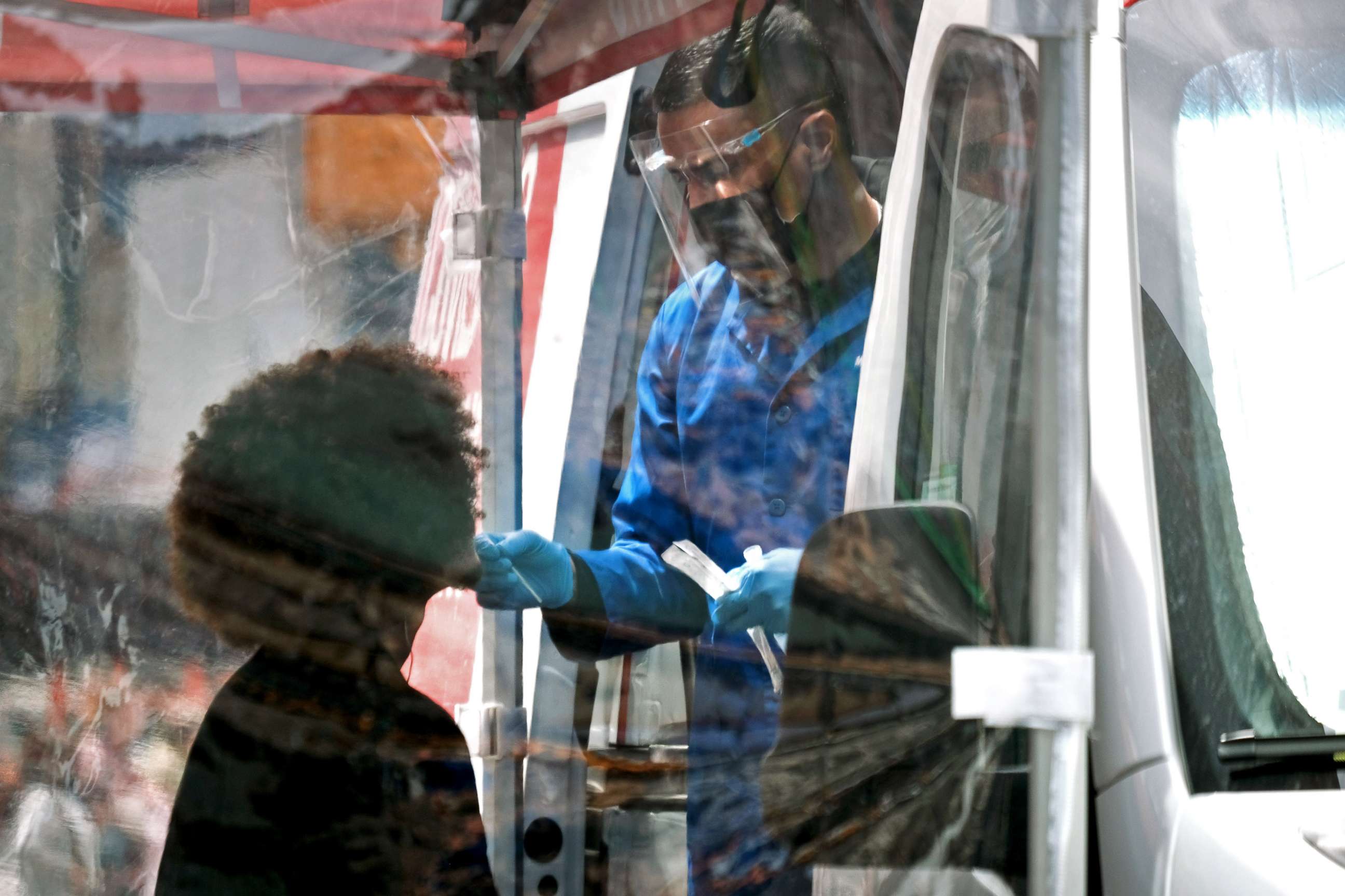 PHOTO: A person is tested at a Covid-19 testing van in Times Square on May 3, 2022 in New York City. 