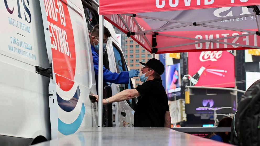 PHOTO: A man is tested at a COVID-19 testing van in Times Square, New York, June 06, 2022.ress)