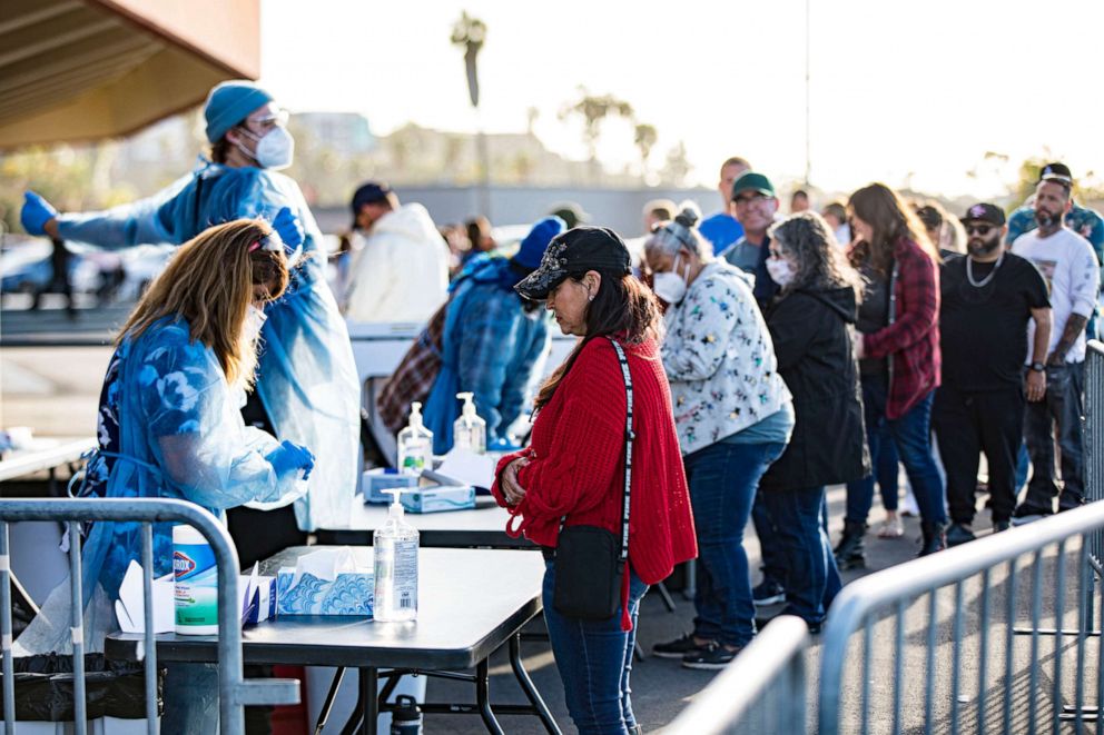 PHOTO: In this March 29, 2022, file photo, fans line up at the COVID-19 testing site on opening night of the Tomlin UNITED Tour, in San Diego, Calif.