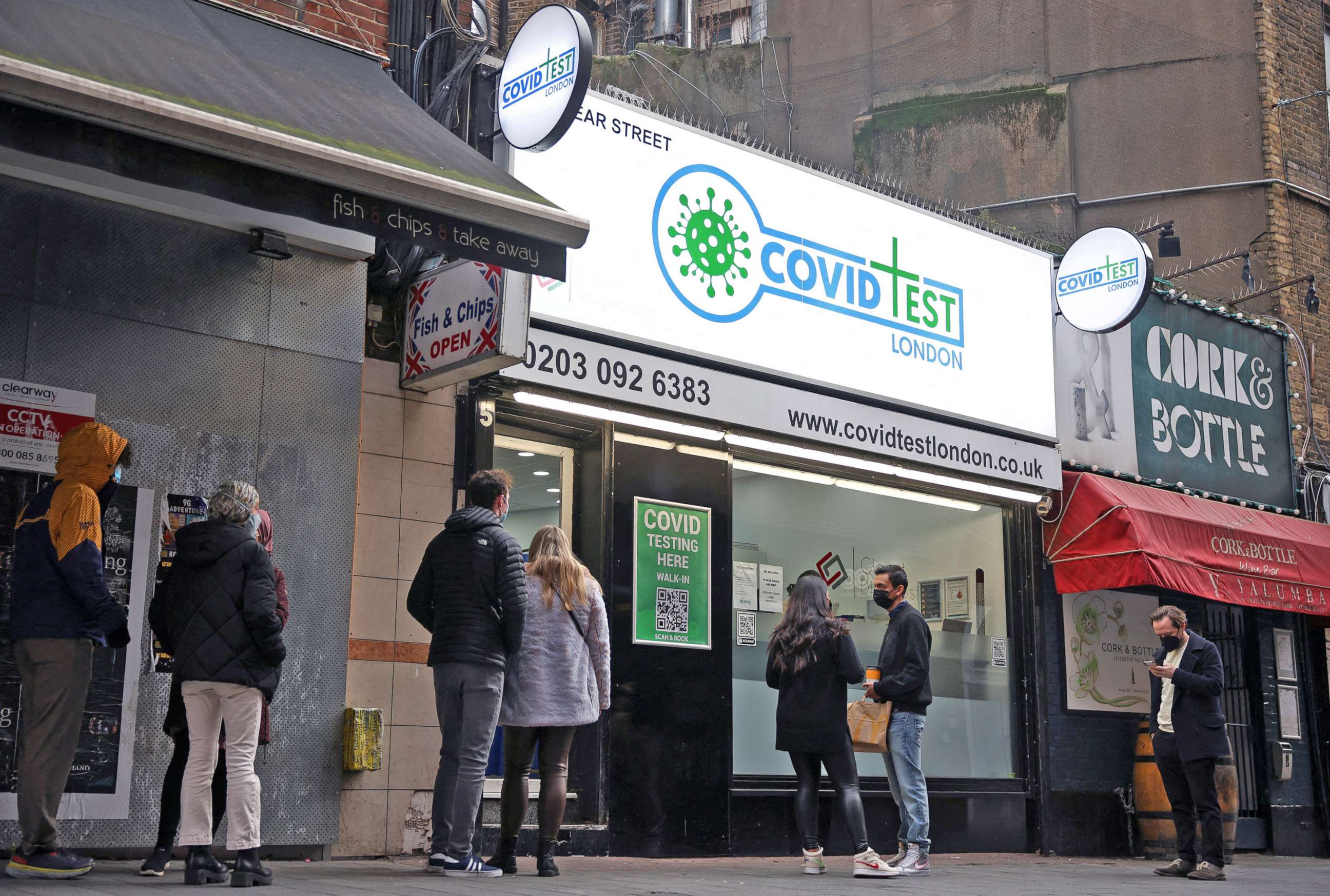 PHOTO: People queue outside a coronavirus disease testing facility in central London, Jan. 2, 2022. 