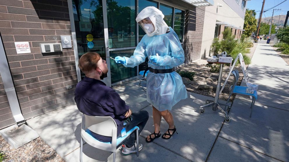 PHOTO: Clay Harris receives a COVID-19 test outside the Salt Lake County Health Department, on July 22, 2022, in Salt Lake City.