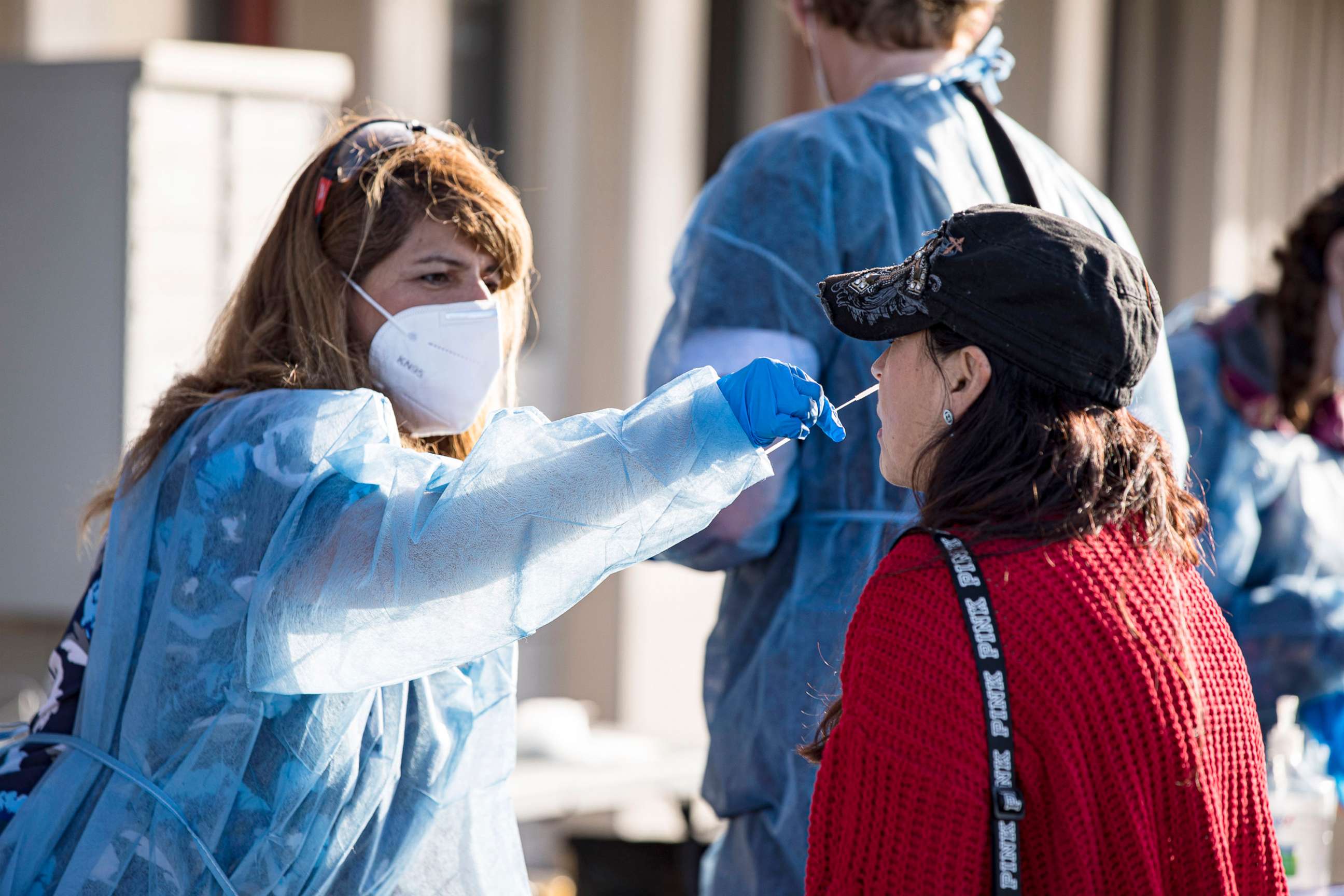 PHOTO: A fan is swabbed at the COVID-19 testing site prior to attending the opening night game of the Tomlin UNITED Tour on March 29, 2022 in San Diego, Calif.