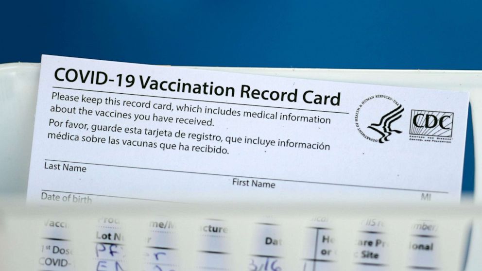 PHOTO: A vaccination record card is shown during a COVID-19 vaccination drive for Spring Branch Independent School District education workers Tuesday, March 16, 2021, in Houston. School employees who registered were given the Pfizer vaccine.