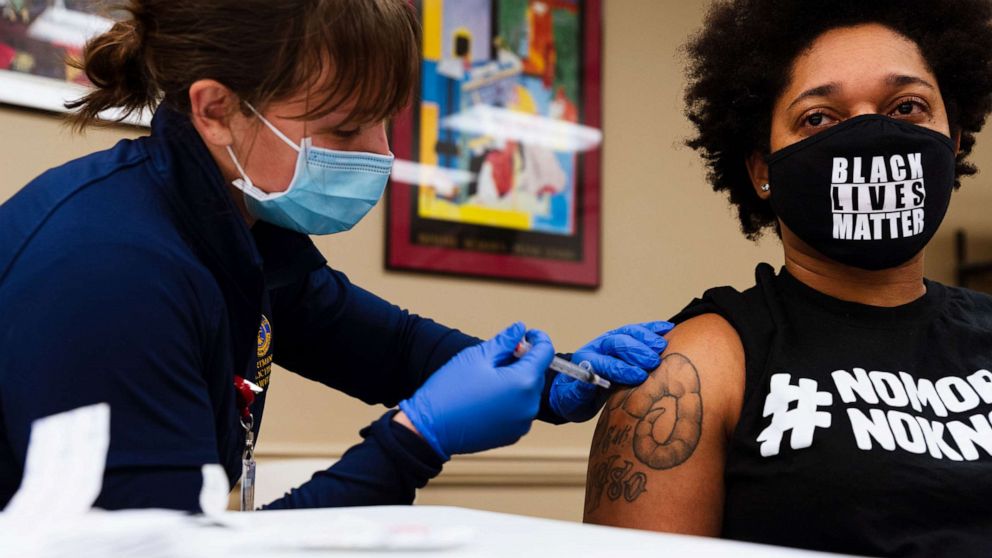 PHOTO: Keturah Herron of the ACLU receives a Moderna COVID-19 vaccination at the Louisville Urban League in Louisville, Ky, Jan. 20, 2021